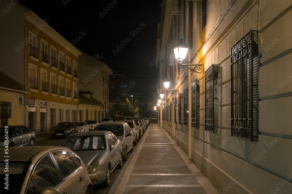 Illuminated Street Lights In City At Night