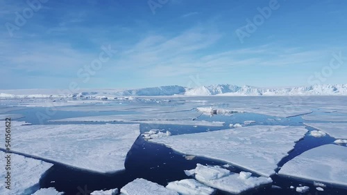 Snow covered antarctic surface aerial view flight. Frozen south pole. Desert white land of snow and ice drone shot. 