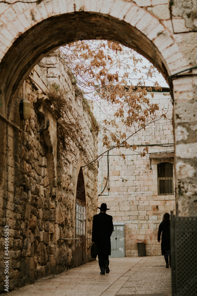 Jewish man silhouette walking streets of Jerusalem, Israel