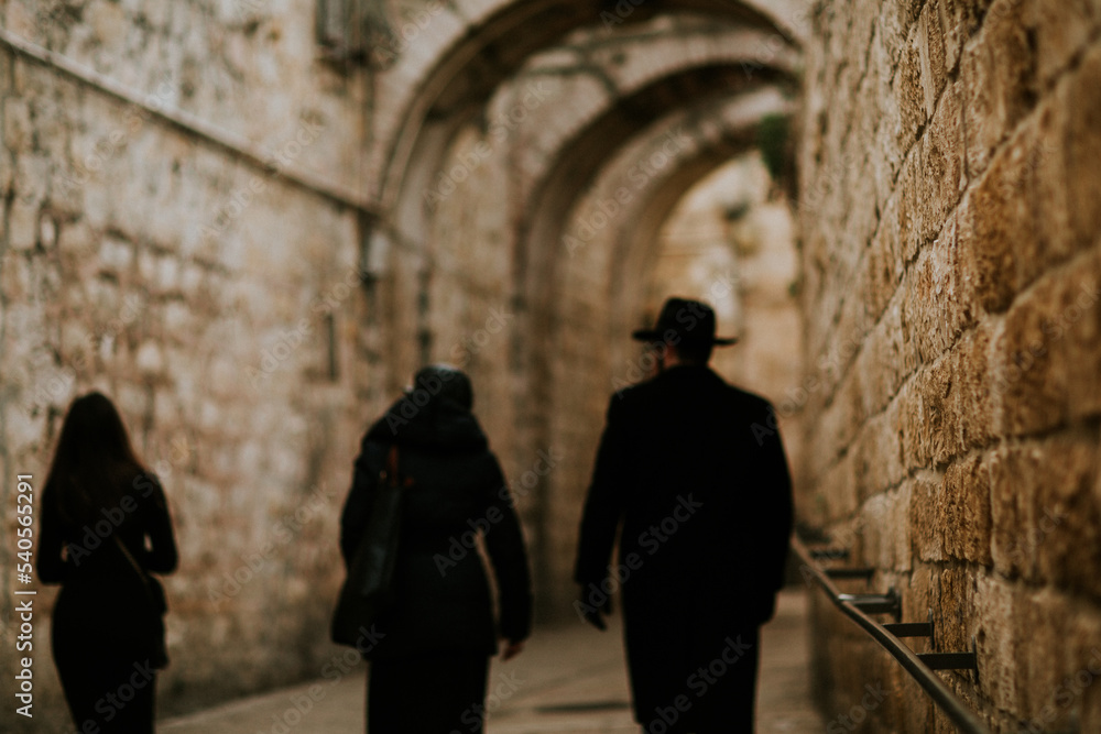 Jewish people walking in street, old city jerusalem