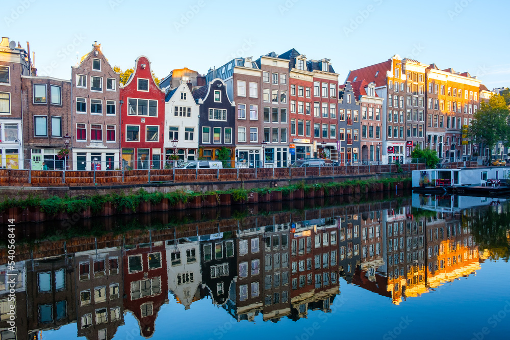 Amsterdam Netherlands - colorful buildings reflected in a canal