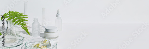 Banner Petri dishes with cosmetic on white background. Copy space. Concept skincare. Dermatology science cosmetic laboratory. Natural medicine,cosmetic research, organic skin care products