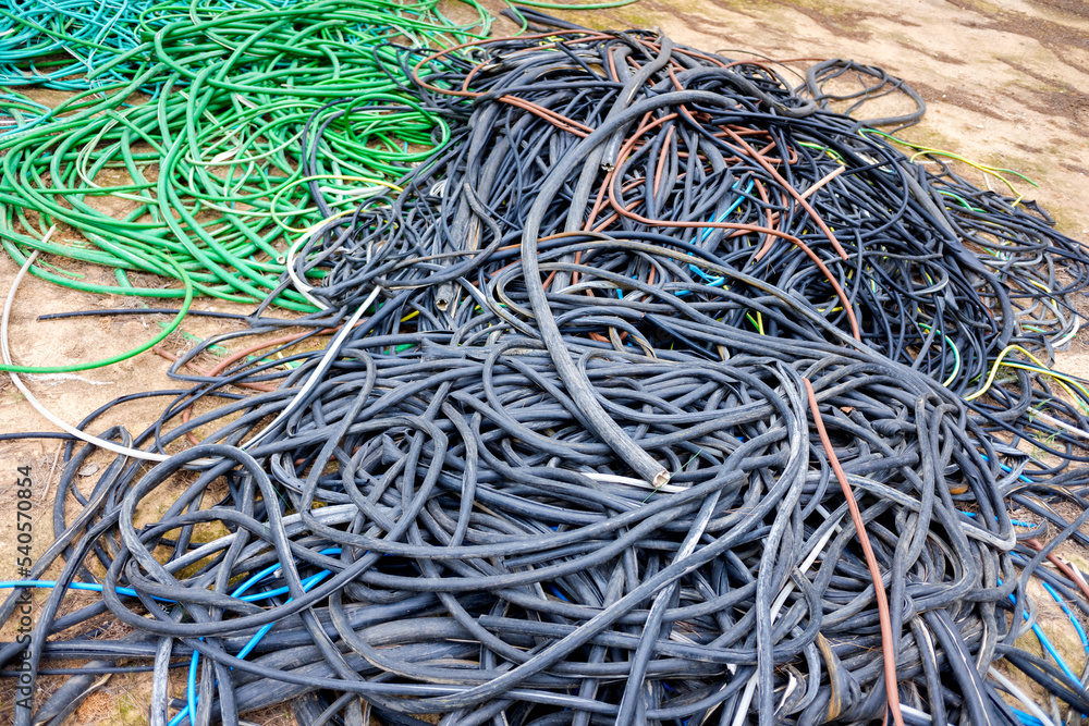 Outer casings of pvc electrical cables, abandoned and discarded, ready for recycling.