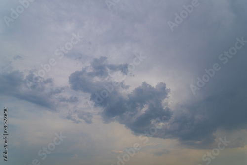 Fototapeta Naklejka Na Ścianę i Meble -  A nimbostratus cloud is a multi-level, amorphous, nearly uniform and often dark grey cloud that usually produces continuous rain, snow or sleet, White gray cloudy sky, Nature background.
