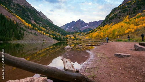 Time Lapse Beautiful View Of Maroon Bells Under Clouds While Tourists Exploring During Vacation - Elk Mountains, Colorado photo