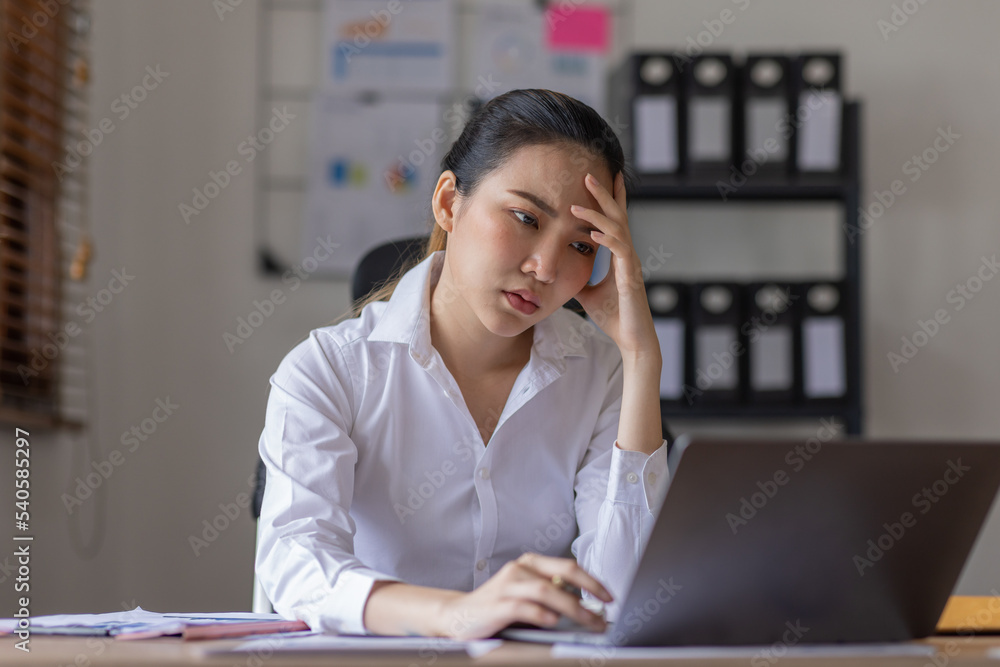 Young business Asian woman stressed while working, Tired asian businesswoman with headache at