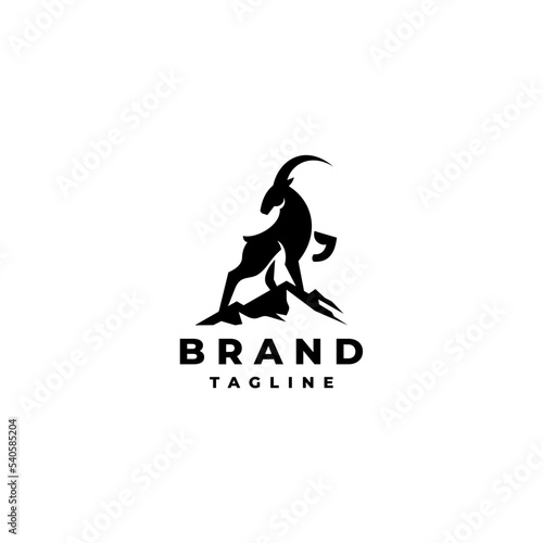 Silhouette of a Goat Standing on the Top of a Mountain Logo Design. Goat And Mountain Silhouette Illustration Logo Design.