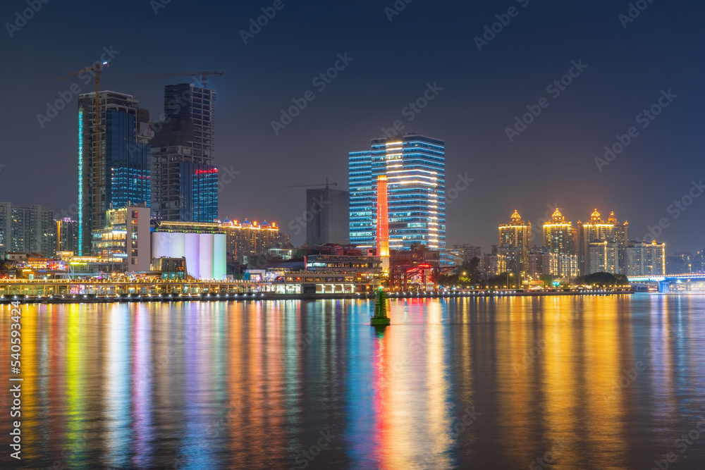 The skyline of urban architecture and the night view of the ancient canal in Guangzhou, China The skyline of urban architecture and the night view of the ancient canal in Guangzhou, China