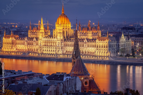 Parliament illuminated and Danube River at dramatic evening, Budapest, Hungary