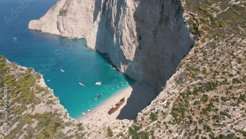 Towering Limestone Cliffs With Shipwreck Boat Panagiotis, Zakynthos Coast, Ionian Islands Of Greece. Aerial Shot photo