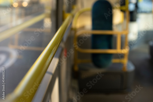 Handrail in bus. Yellow handrail. Interior of public transport.