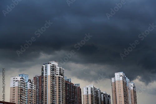 Storm clouds over the city buildings