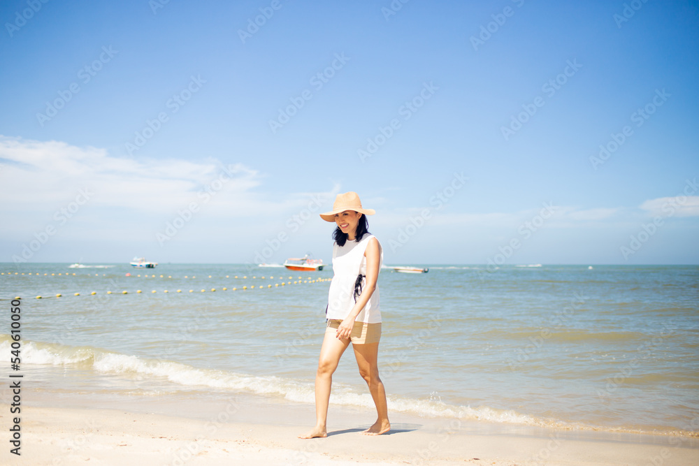 beautiful happy woman walking down the beach beautiful happy woman walking down the beach