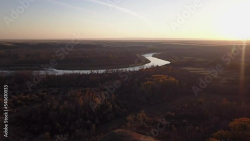 Autumn colour: Aerial sunset pan across Bow River Valley, Siksika photo