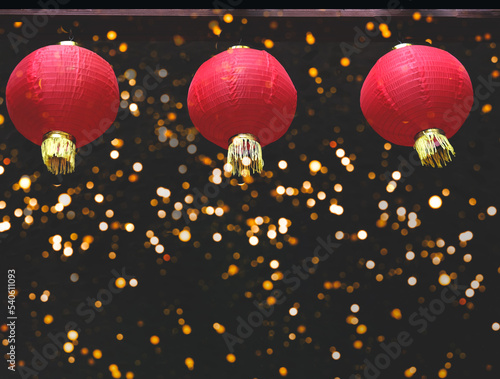 Red paper lanterns on dark background with sparkles. Concept of Chinese new year. Close-up