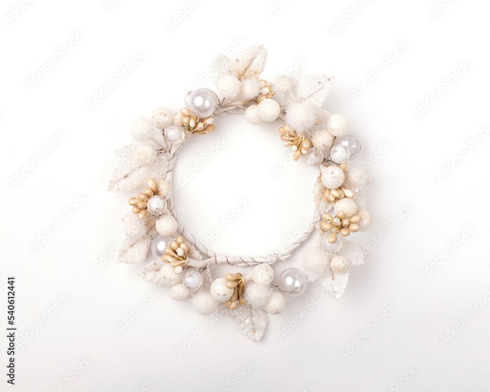 White decorative wreath on a white background. Holiday decoration, Christmas decoration. Image with place for text. White decorative wreath on a white background. Holiday decoration, Christmas decoration. Image with place for text.