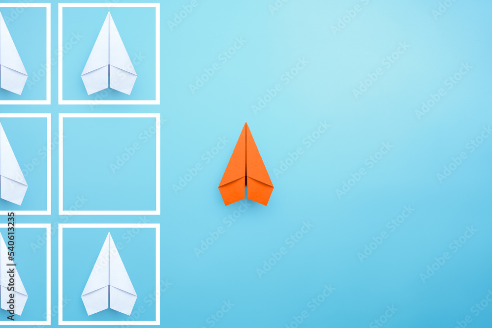 Business for solution concept with orange paper planes on blue background. think outside the box, different thinking, copy space Business for solution concept with orange paper planes on blue background. think outside the box, different thinking, copy space