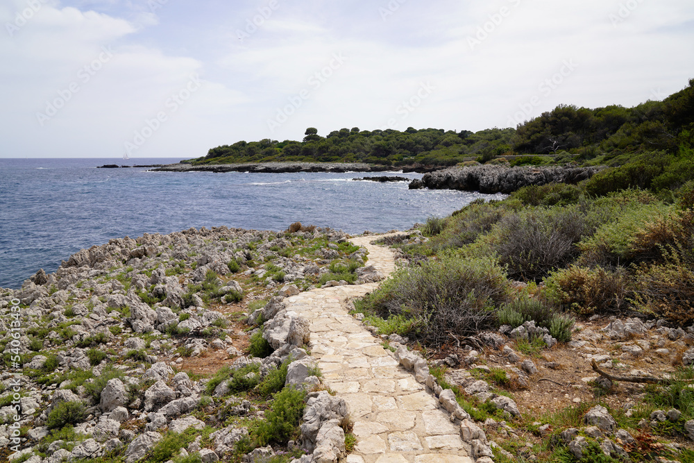 beach stone pathway to sea in south Antibes Juan-les-Pins France southeast