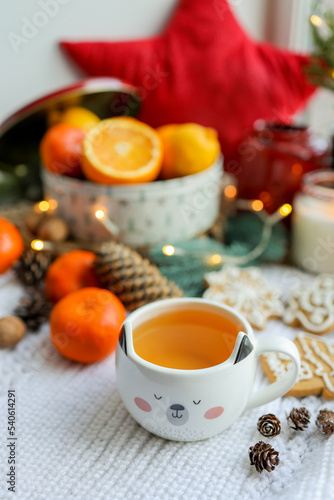 Cute cup of tea in New Year's decor, cozy photo