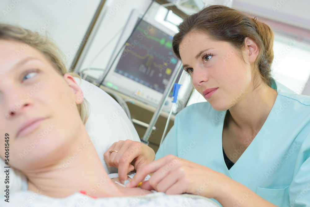 nurse caring for female patient nurse caring for female patient