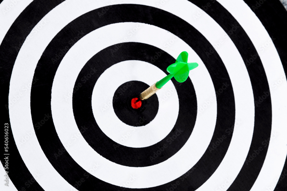 Dart hitting on center target Dart hitting on center target