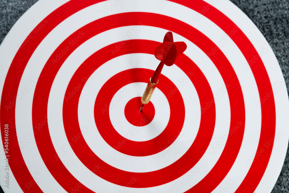 Dart hitting on center target Dart hitting on center target