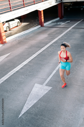 Fit Chinese Woman Running in the City