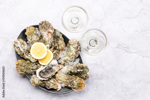 Fresh oysters with glasses of sparkling wine