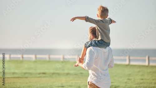 Obraz na plátně Father, child and shoulders for walk in nature spending quality time or bonding together in the outdoors
