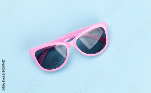Sunglasses on blue background