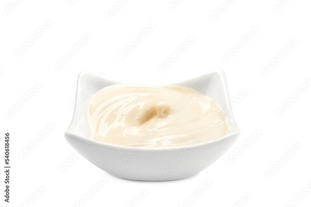 A bowl filled with mayonnaise on a white background A bowl filled with mayonnaise on a white background