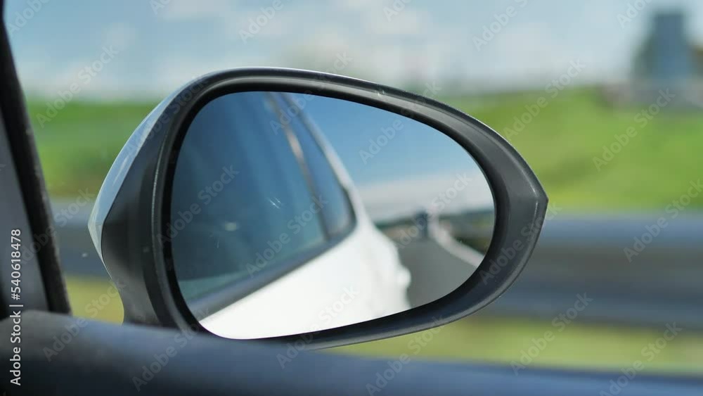 Side mirror of a car. Focus on the frame of the mirror. Side mirror of a car. Focus on the frame of the mirror.