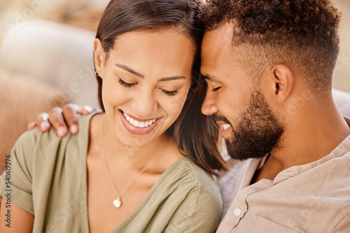 Black couple, happy and love on sofa in closeup, living room and hug for bonding, care and together. Woman, man and happiness for embrace, smile and romantic for relationship in home, house or lounge © Beaunitta V W/peopleimages.com