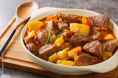 Tableau sur toile Traditional Irish stew of meat and vegetables in a thick sauce based on dark beer close-up in a pot on the table