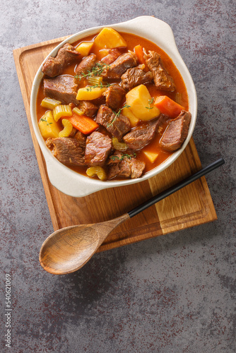 Irish stew stobhach is a stew native to Ireland that is traditionally made with root vegetables and meat closeup in the pot on the table. Vertical top view from above