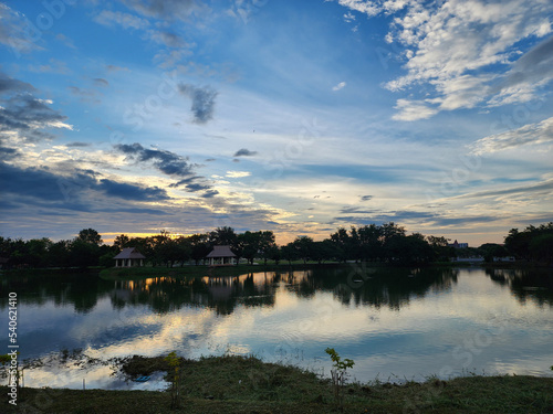 Watching the sunset over the calm lake is the perfect way to unwind.