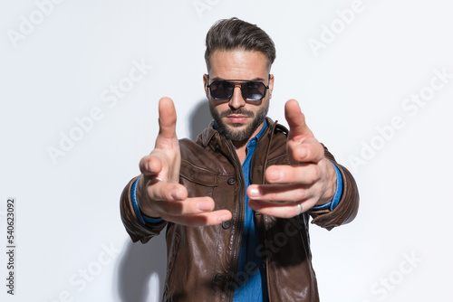 Fotografija Sexy casual man dominating the frame with both his hands