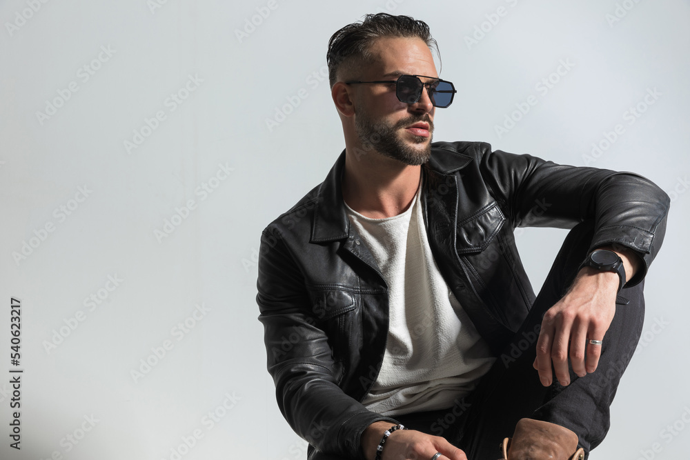 © Viorel Sima - fashion modern man in leather jacket with sunglasses looking to side © Viorel Sima - fashion modern man in leather jacket with sunglasses looking to side