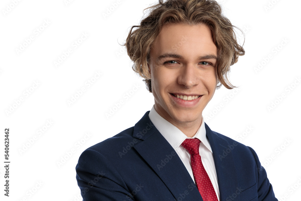 portrait of handsome young man with curly long hair and blue eyes portrait of handsome young man with curly long hair and blue eyes