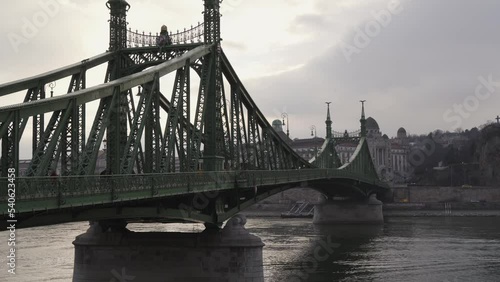 Tram crossing Liberty or Freedom bridge in Budapest Hungary, following closeup view