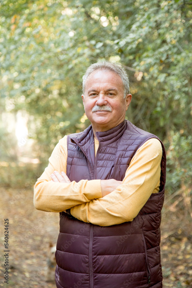 Portrait of a sportive mature man in the forest Portrait of a sportive mature man in the forest