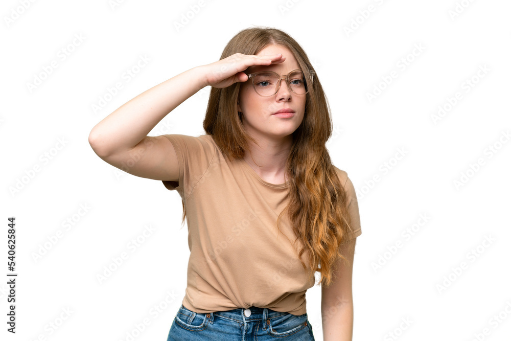 Young pretty woman over isolated background looking far away with hand to look something Young pretty woman over isolated background looking far away with hand to look something
