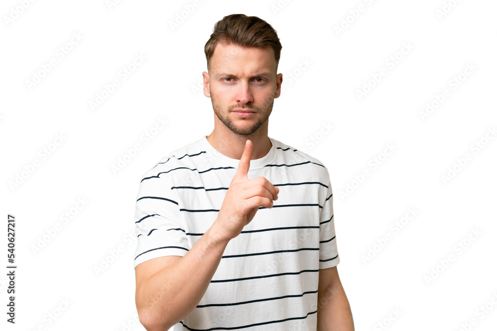 Young blonde caucasian man over isolated background frustrated and pointing to the front Young blonde caucasian man over isolated background frustrated and pointing to the front