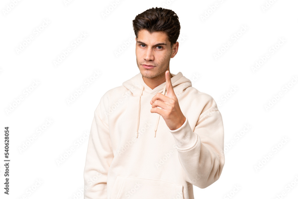 Young caucasian handsome man over isolated background frustrated and pointing to the front Young caucasian handsome man over isolated background frustrated and pointing to the front