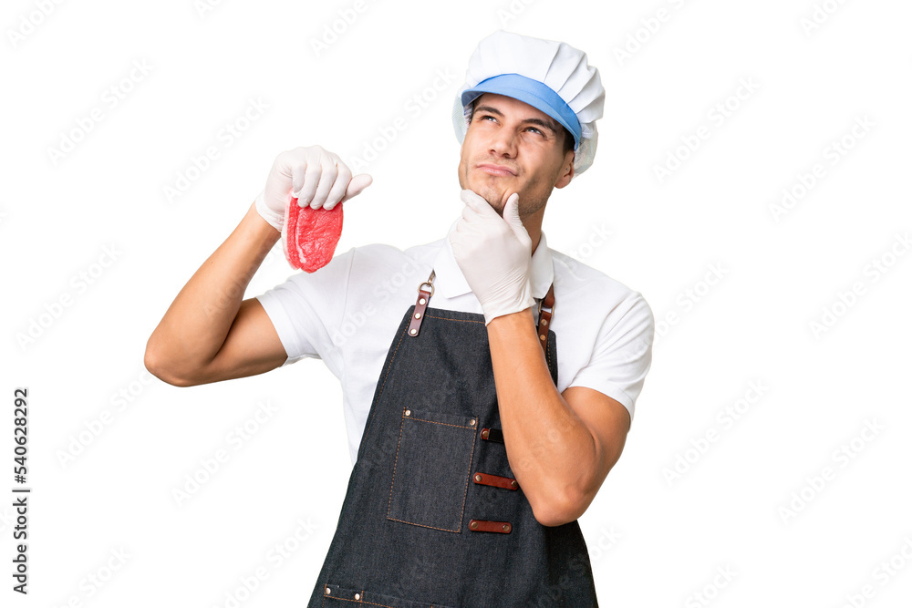 Butcher caucasian man wearing an apron and serving fresh cut meat over isolated background having doubts Butcher caucasian man wearing an apron and serving fresh cut meat over isolated background having doubts