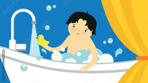 Boy bathes in a tub with a rubber duck