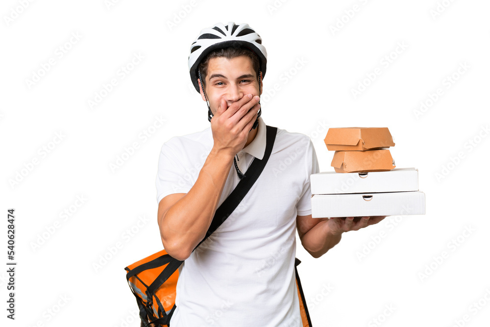 Young caucasian man with thermal backpack over isolated background happy and smiling covering mouth with hand Young caucasian man with thermal backpack over isolated background happy and smiling covering mouth with hand