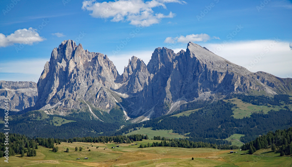 Panoramic majestic mountain view in the dolomites: Distinctive Sassolungo mountain group at gardena valley in south tyrol. 