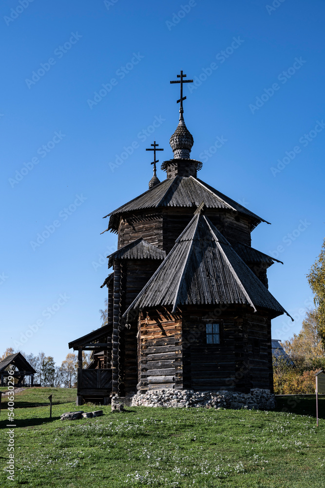 ancient architecture with elements of wooden architecture against the background of the autumn sky