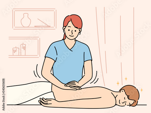 Woman do manual massage for client 